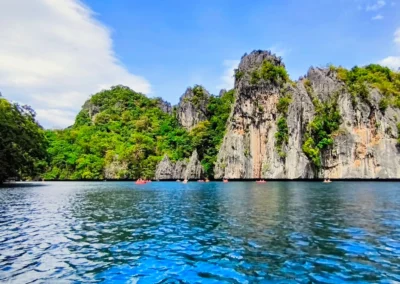 Kayaks navigating Big Lagoon in El Nido, Palawan. The main highlight of the private Island Hopping tours.