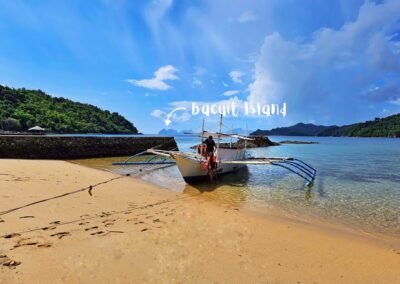Filipino bangka boat for a private tour on the beach at DK2 Resort, El Nido, ready for a tailor-made experience.