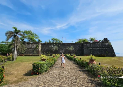 Front view of Fort Santa Isabel in Taytay, Palawan. Historic 17th-century Spanish stone fortress with cobbled path and gardens.