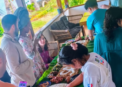 Traditional Filipino "Boodle Fight" feast with fresh seafood and rice. Safe and authentic local gastronomy experience for families at the resort.