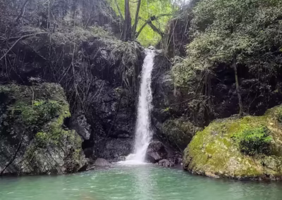 Hidden waterfall trekking in the El Nido jungle. Nature and adventure excursions exploring the interior of Palawan.