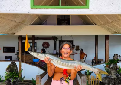 Resort staff displaying the fresh catch of the day. Authentic El Nido seafood and shellfish straight from the ocean to our kitchen.
