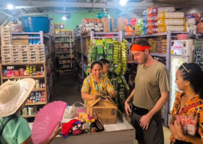 Interacting with friendly local shopkeepers at a traditional Filipino market.